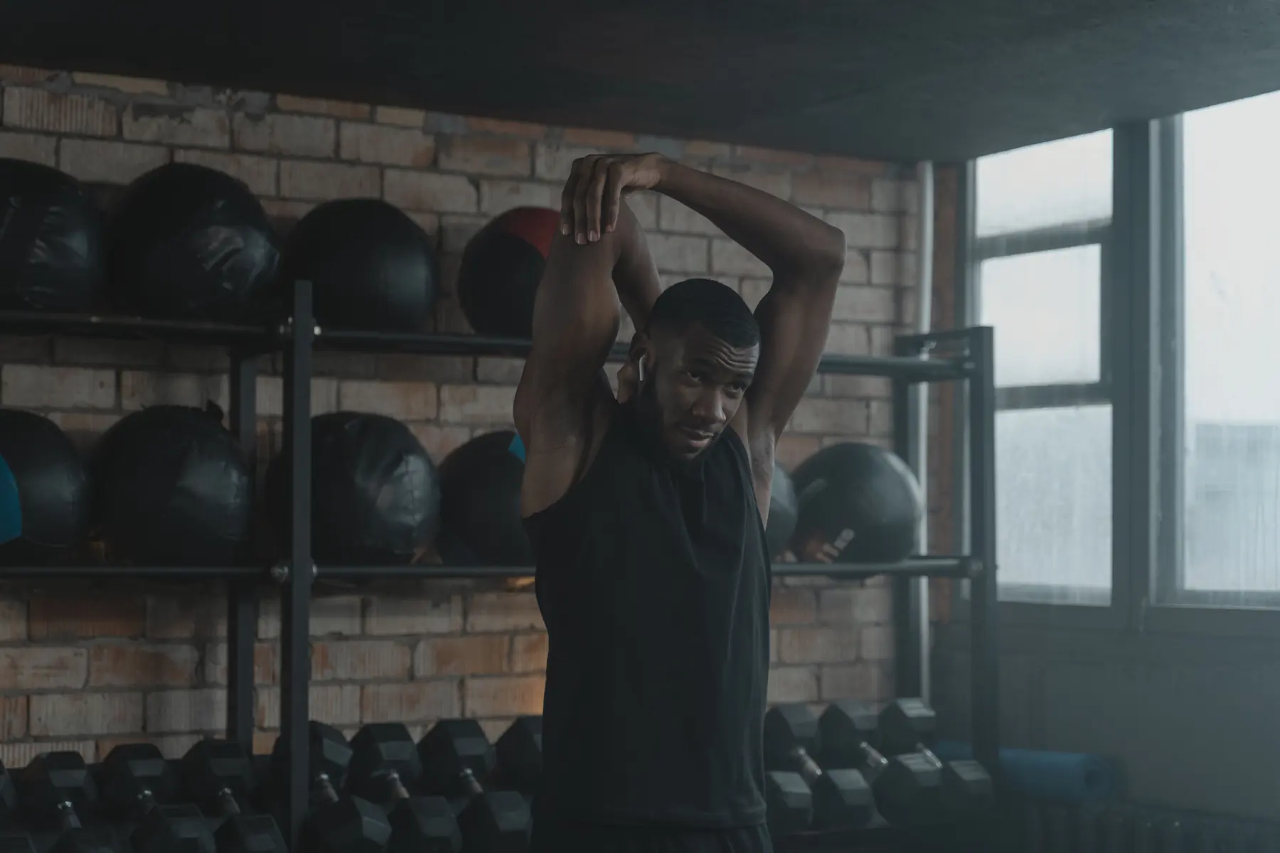 Theo stretching in front of the medicine-ball wall