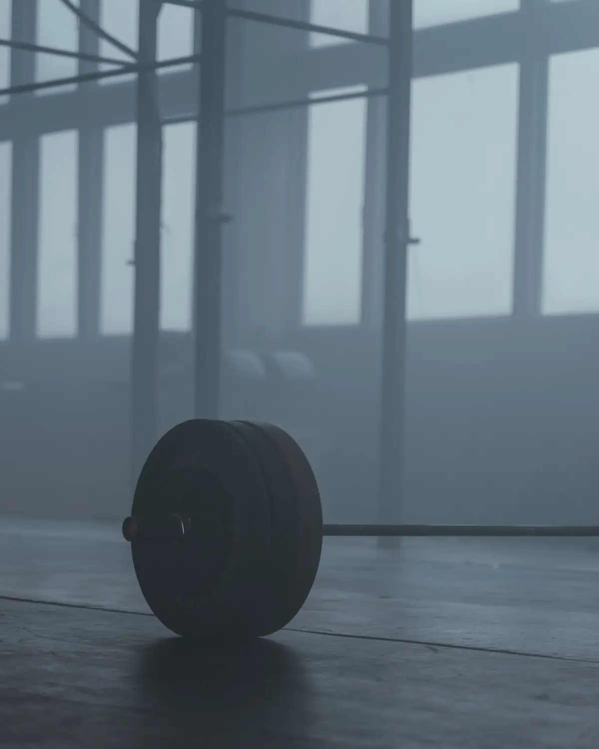 A loaded bar resting on a platform in the morning haze